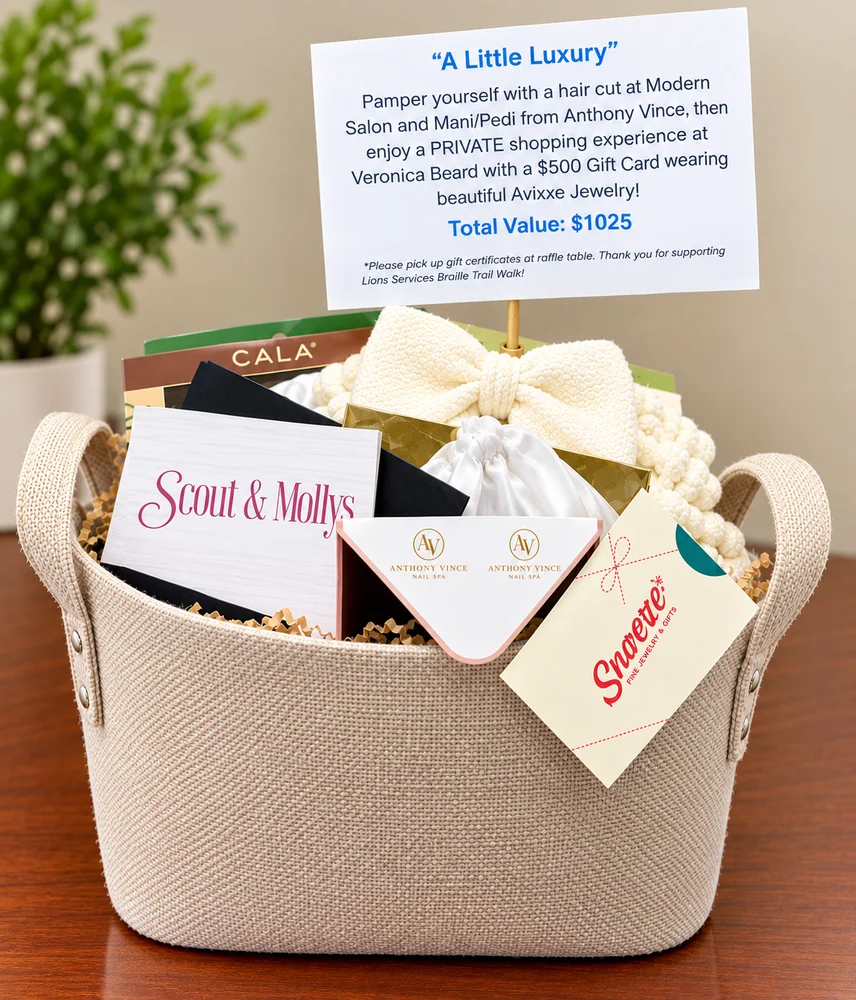 Cream woven basket of salon and boutique gift cards with a ribboned gift box and a printed prize card.