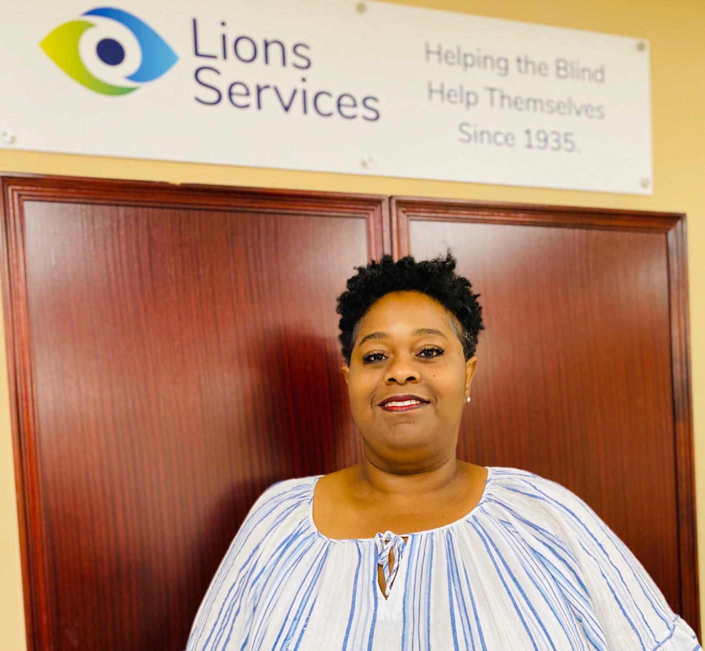 Photo of Tracy, a Lions Services product assembler who rebuilt her life after sudden vision loss following the birth of her twins