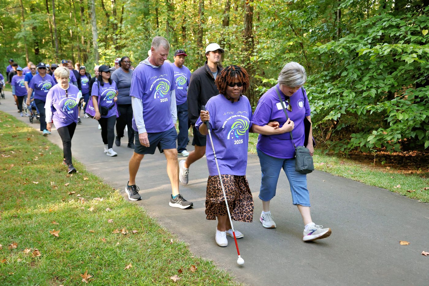 Walkers exploring tactile art along the Charlotte Braille Trail at the 2025 Walk