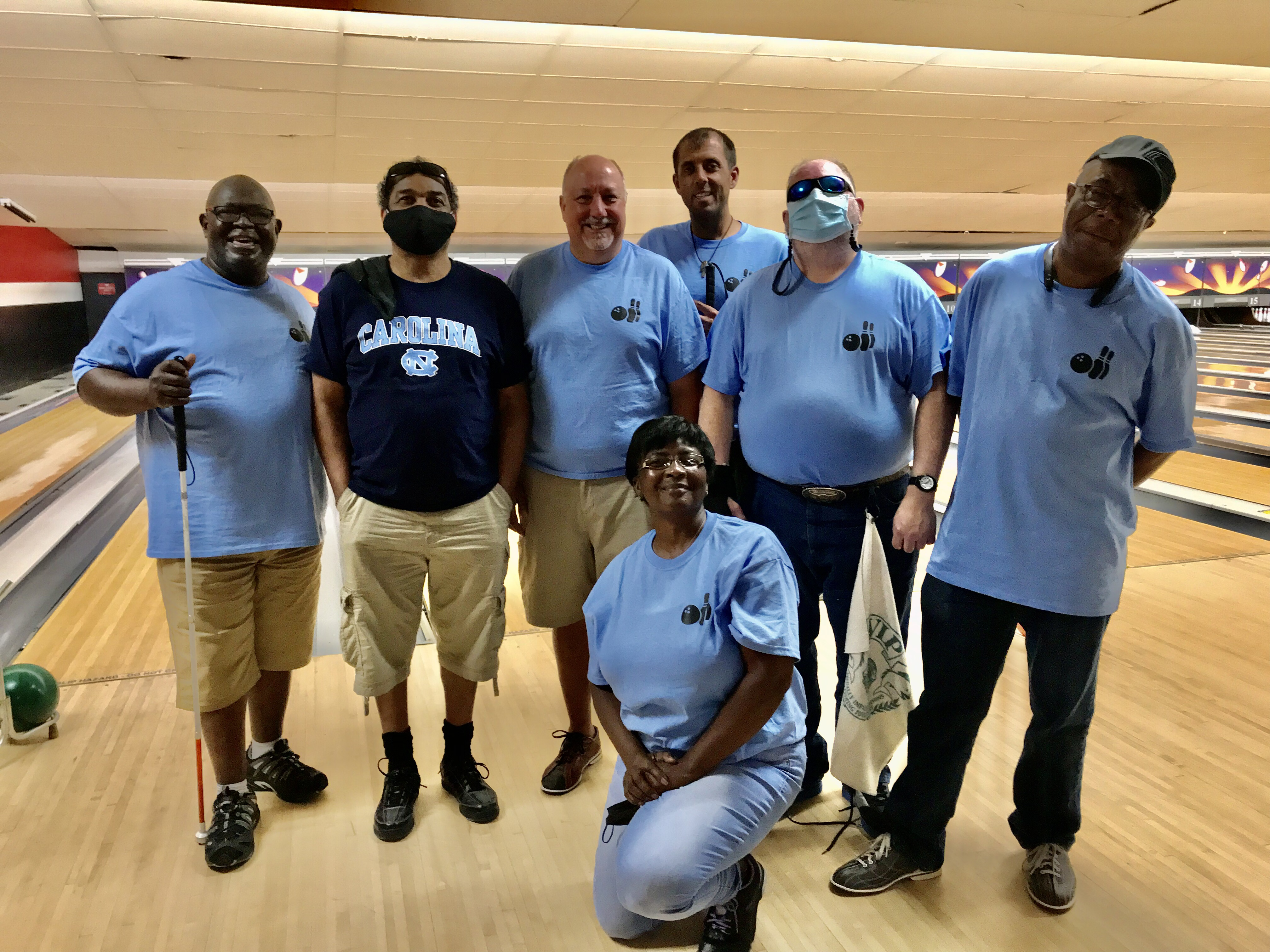 Peggy Washington, President of the Carolina Crushers with Her Team in this Image.