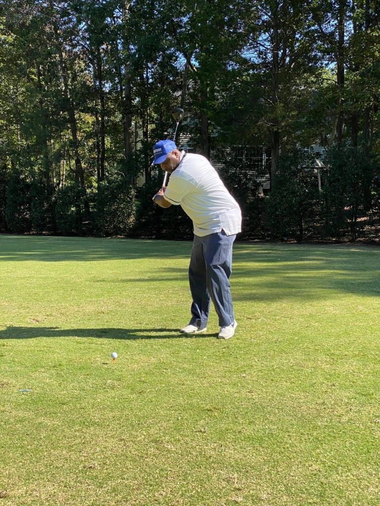 Shown in This Image: Marlon Stover Swings Big with his Golf Club and Drives the Ball During Fundraising Tournament