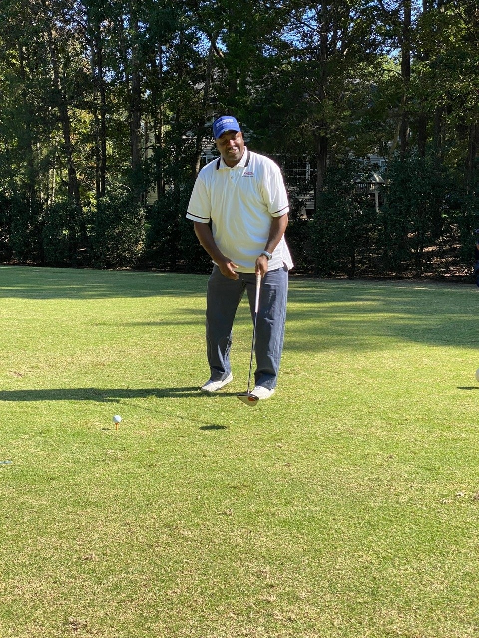 Marlon Stover Posing for a Photo of him Golfing on The Course